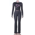 Close-up of pink Girl lettering on black polka dot tracksuit with zipper detail - XS / Black