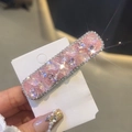 Close-up of pink crystal hair clip with sparkling rhinestones held by hand - 1 Piece (Pink)