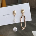 Asymmetric gold baroque pearl earrings with irregular metal geometric shapes on card - Gold