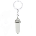 Detailed close-up of a clear crystal quartz hexagonal pendant on a metal keychain - White Crystal