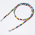 Detailed close-up of colorful beads strap with silver lobster clasps on white background - High Saturation Colorful