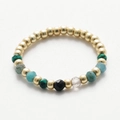 Macro shot of handmade beaded ring with natural stones and polished golden metal beads - Gold Multicolor