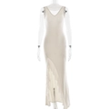 Dettaglio dell'abito lungo beige con scollo a V e orlo a balze asimmetriche - S / Giallo