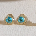Golden heart-shaped stud earrings with sky blue zircon stones and white crystal halo - Light Blue