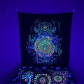 Detail of UV reactive blacklight tapestry with neon mandala and fluorescent pillows - Mandala Totem Fluorescent
