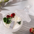 Scented soy candle in embossed glass jar with dried red roses and floral decorations - Blackberry Jasmine