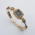 Detail of square gold watch with crystal flower bracelet strap and grey dial - Rose Gold Case Black Dial