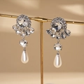 Macro shot of silver drop earrings with floral crystal stud and teardrop pearl detail - Baroque Pearl Rhinestone Flower Style / Silver (Silver Pin)