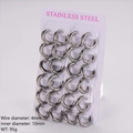 Dettaglio orecchini a cerchio in acciaio inossidabile da 4mm, set da 12 paia argento - Diametro Interno 10mm / Color Acciaio