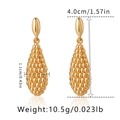 Detail view of gold earrings featuring 4.0cm height and 1.1cm width dimensions - Granulated Teardrop (KE1146) / Gold
