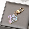 Iridescent acrylic diamond keychain with gold metal hook on a jewelry display box - Laser Iridescent Gem