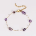 Detail of gold chain bracelet with irregular amethyst stones and white pearls - Bracelet