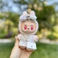 Pink Labubu doll wearing a tweed camellia outfit and a luxury branded quilted mini bag - White Iridescent Fragrance Keychain + Small C-shaped Bag / First And Second Generation Keychains Are Compatible With La Cloth Dolls. Dolls Not Included.