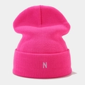 Detail of hot pink ribbed knit beanie featuring minimalist silver letter N embroidery - One Size / Light Rose