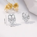 Macro shot of silver heart earrings with white zircons showing 11mm height dimension - EH759 Heart Zirconia Tassel Studs