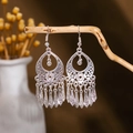 Detail of silver bohemian dangle earrings with hollow geometric patterns and teardrop tassels - Silver Hollow Drop Pendant(E2875-25)