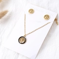 Detail of 18k gold tree of life jewelry set with black enamel border on card - Necklace + Earrings Set / Gold-Black