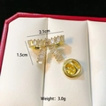 Detail showing golden bow brooch size 2.1cm x 1.5cm with clear zircon on red velvet - Gold Bowknot C212