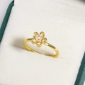 Detail of a gold flower ring with a pink pearl and zircon petals in a green velvet box - Pink Pearl Flower Design Style (金色3)
