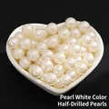Creamy ABS faux half-drilled pearls displayed in a heart-shaped ceramic bowl - Premium Half Drilled / 12mm / Pearl