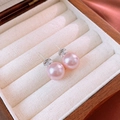 Macro shot of elegant pink pearl stud earrings placed in a premium wooden jewelry box - Pink Pearl Studs (12mm)