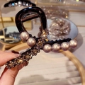 Close-up of tortoise shell hair claw clip with elegant pearls and shimmering rhinestones - Pearl Hair Claw-8CM