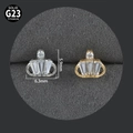Detailed macro view of G23 titanium crown studs with zircons in silver and gold colors - Crown (Square Gem) NO-4
