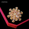 Macro detail of 2.7cm gold floral brooch with emerald green teardrop and pink crystals - Pink Flower Style (B745)