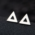 Minimalist silver triangle hollow stud earrings in stainless steel on a black display - Hollow Triangle / Silver