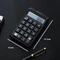 Sleek black office calculator with cute icons and large text buttons, 15.3x9.5cm size - Black 859b