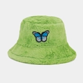 Detail showing plush faux fur texture and butterfly embroidery on the green bucket hat - Green