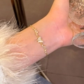 Elegant gold butterfly bracelet with shell inlay and zircon stones on a female wrist - S765 Gold