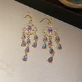 Orecchini vintage dorati con stella, nappe e cristalli viola a goccia d'acqua - Oro-Viola