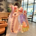 Creative Capybara oil-filled drifting bottle keychain with pink strap and golden bus pendant - Capybara Bus - Pink