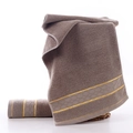 Absorbent grey cotton towel set with honeycomb weave and elegant gold jacquard border - Golden Thread Circle Khaki