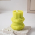 Light green geometric pillar scented candle with vertical ribbed texture on stone base - Origami Geometric Type I / Yellow & Green