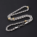 Detailed close-up of a silver stainless steel chain necklace with gold bead accents - 5mm Twist Rope Chain With Gold Beads Necklace