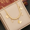 Elegant gold butterfly pendant necklace with crystal accents on a jewelry box - Gold-Tone Butterfly Pendant Necklace (Necklace #1)