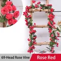 Artificial rose vine in rose red color with 69 flower heads on a rustic wooden ladder - 69 Heads Rose Magenta