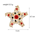 Kerstbroche in stervorm met kleurrijke strass-steentjes op gouden hol metaal - Rood Groene Strass Ster (C144-A)