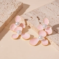 Detailed close-up of pink petal flower earrings with pearls on a textured stone base - Pink Flower (Silver Needle)