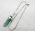 Detail of a dark green hexagonal crystal prism pendant with a silver metal chain - Green Aventurine