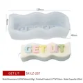 Silicone mold and finished wave candle featuring rainbow GET LIT textured lettering - GET LIT