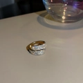 Detail of gold open ring with oval pave zircon stones on a beige surface - Gold Minimalist Micro-pave Open Ring (15#)