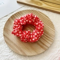Elastic fabric scrunchie in red color with white daisy print on wooden tray - Red Floral
