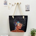 Black canvas tote bag featuring ethnic woman illustration and thick rope handles - Black Woman With Headband And Glasses