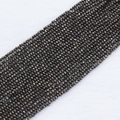 Macro view of 2mm dark grey faceted crystal beads with metallic finish for jewelry making - 2mm (Approx. 210 Beads per Strand) / Gun Black