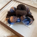 Detail of a brown flocking hair claw clip with colorful knit texture in a wooden box - Hair Claw / Large / Coffee-Blue