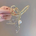 Elegant gold fish tail hair claw clip with sparkling rhinestones and a white pearl - Rhinestone Fishtail