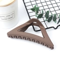 Matte brown triangular hair claw clip for women in a professional still life setting - Matte Coffee